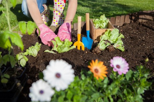Seasonal garden maintenance scene showing pruning and mulch refresh in Limegarden