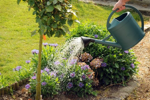 Landscaping team maintaining safe housekeeping while clearing site rubbish